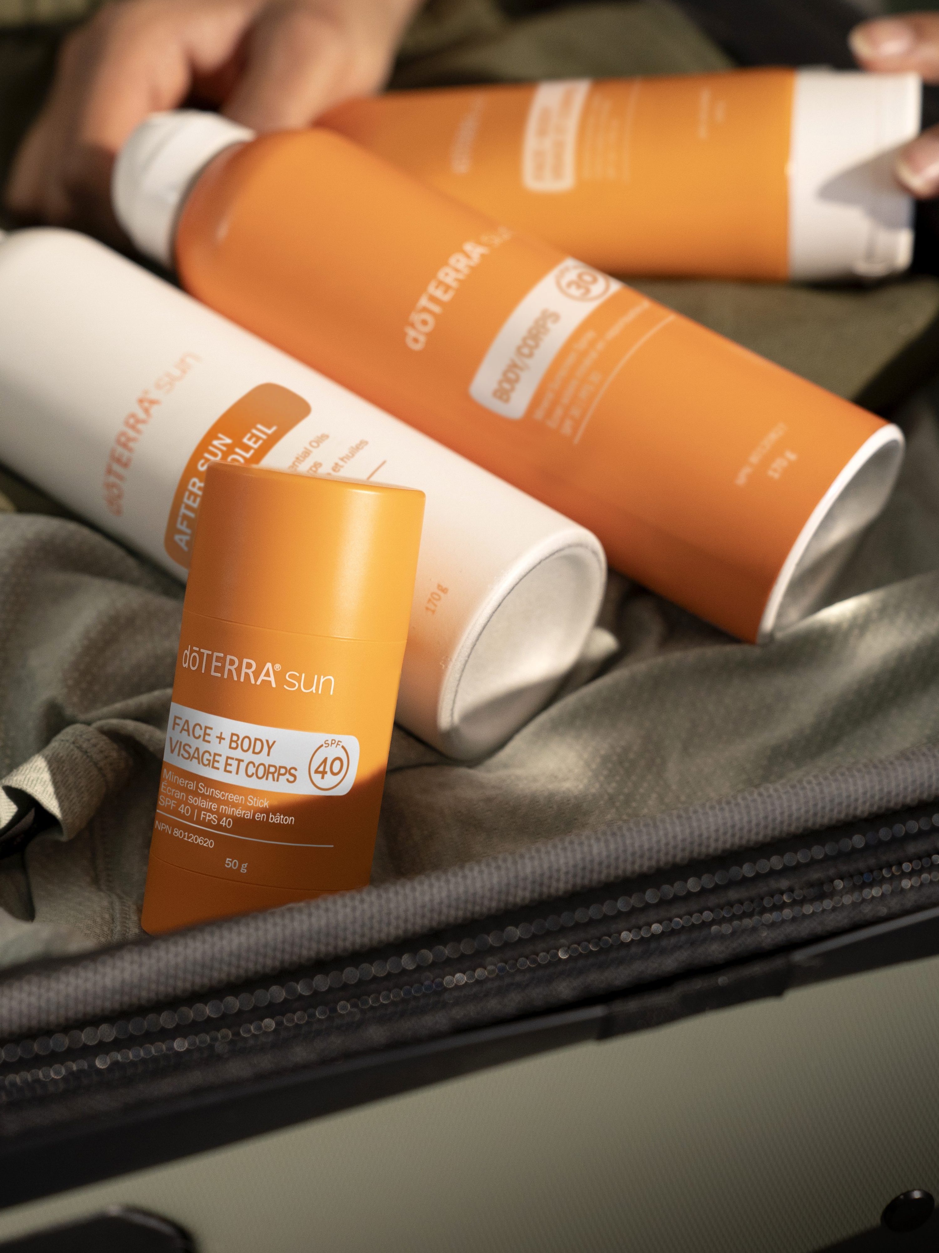 sunscreen items in a suitcase